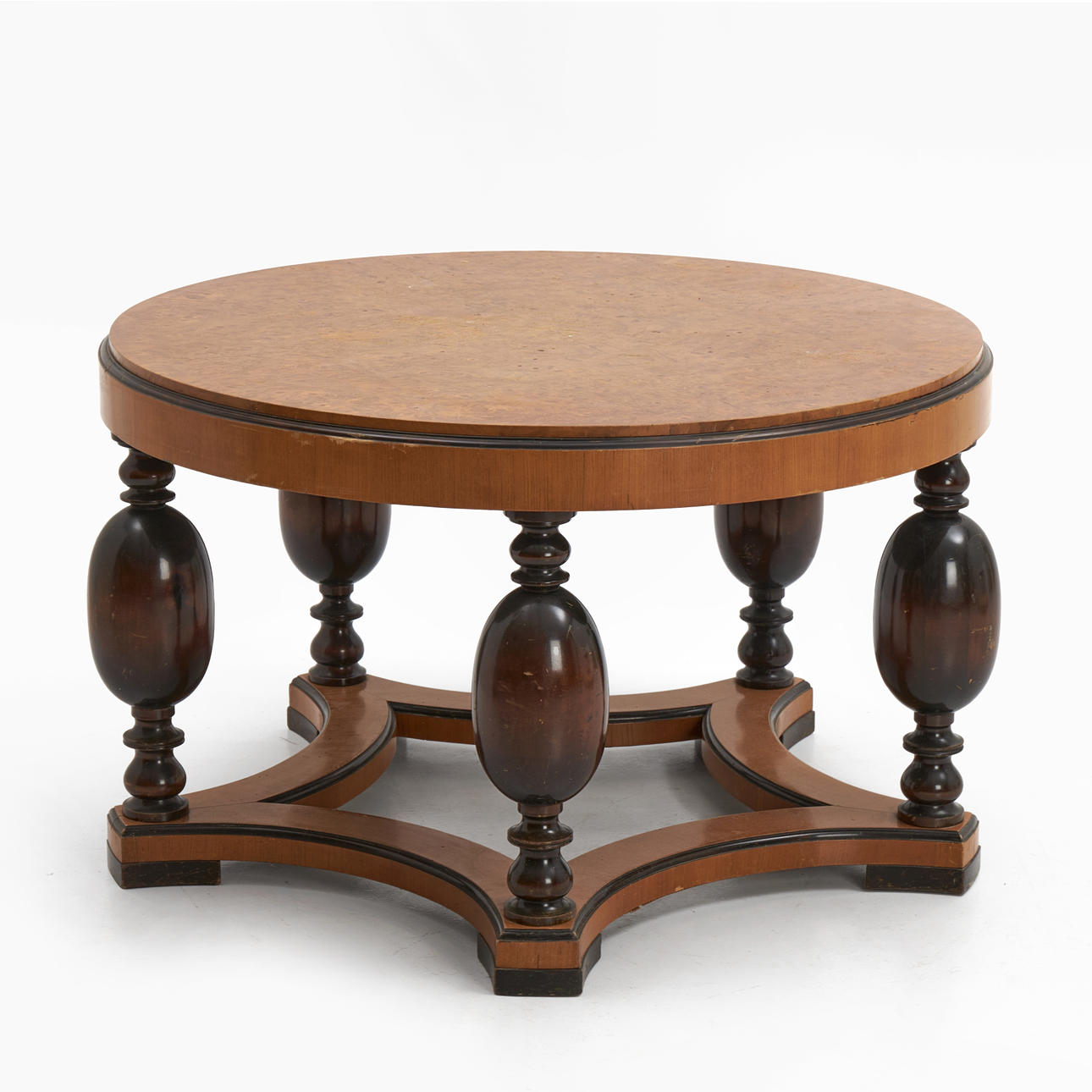 A 1930's coffee table, birch root top, baluster-shaped legs in boned birch.