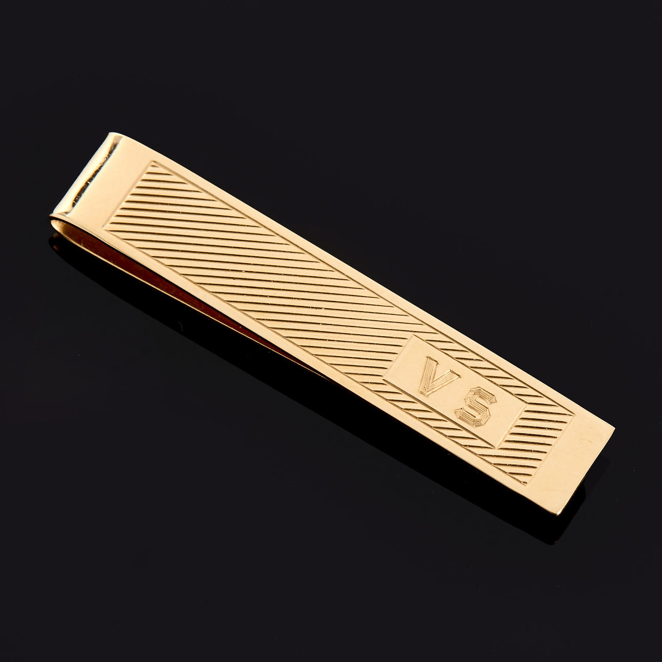 PIN DE CORBATA, oro de 14 quilates con monograma.