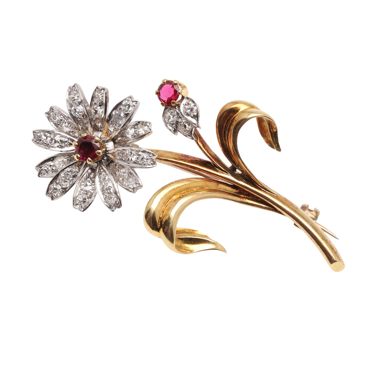 A DIAMOND AND RUBY FOLIATE BROOCH.