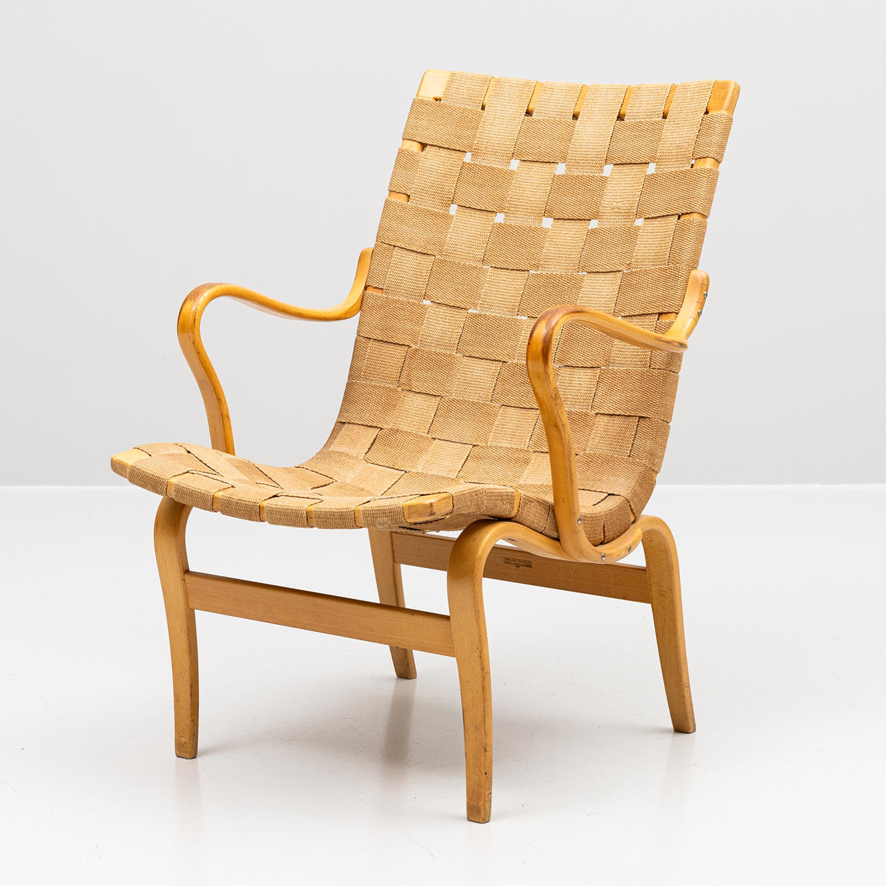 BRUNO MATHSSON. Armchair, beech and saddle made “Eva”, branded.