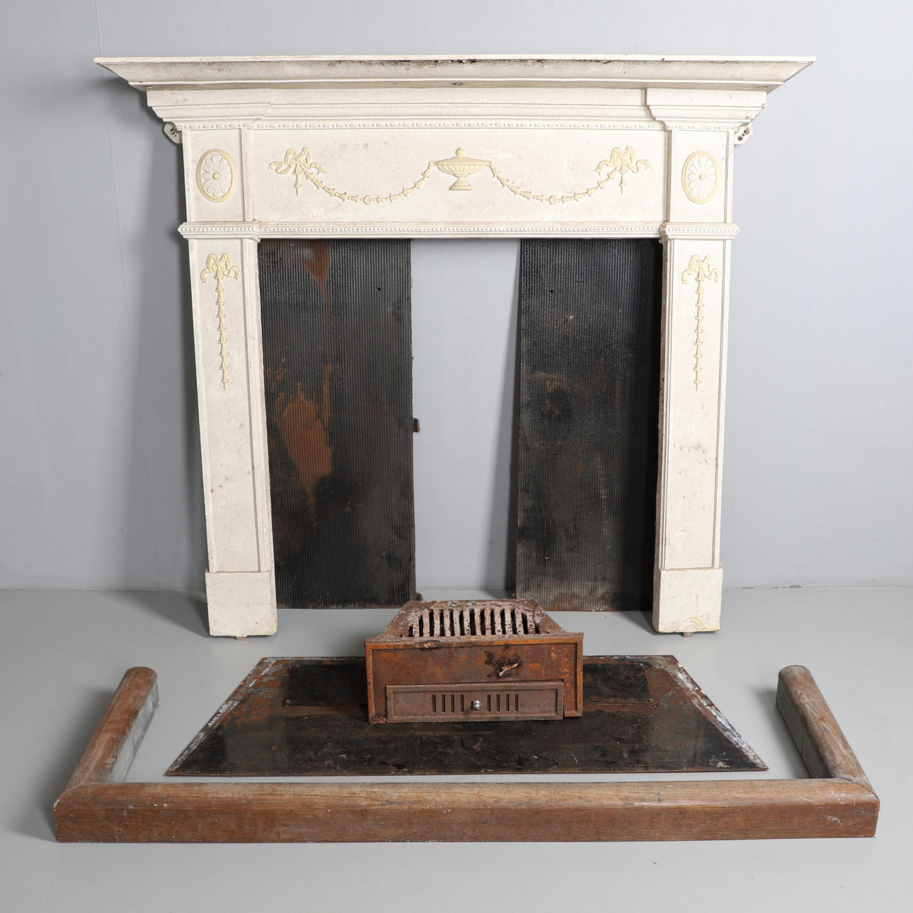 A 19TH CENTURY PAINTED CAST IRON FIREPLACE.