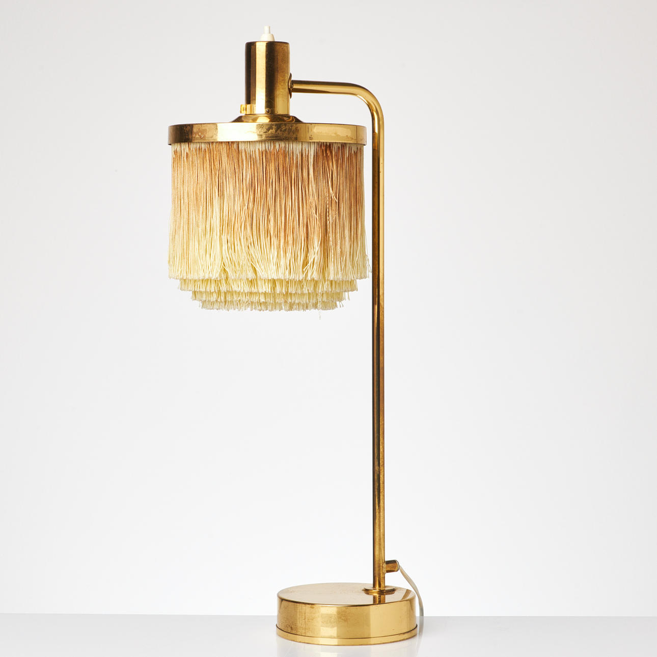 HANS AGNE JAKOBSSON, A table lamp, model B140, frame in brass, fringes, Markaryd.