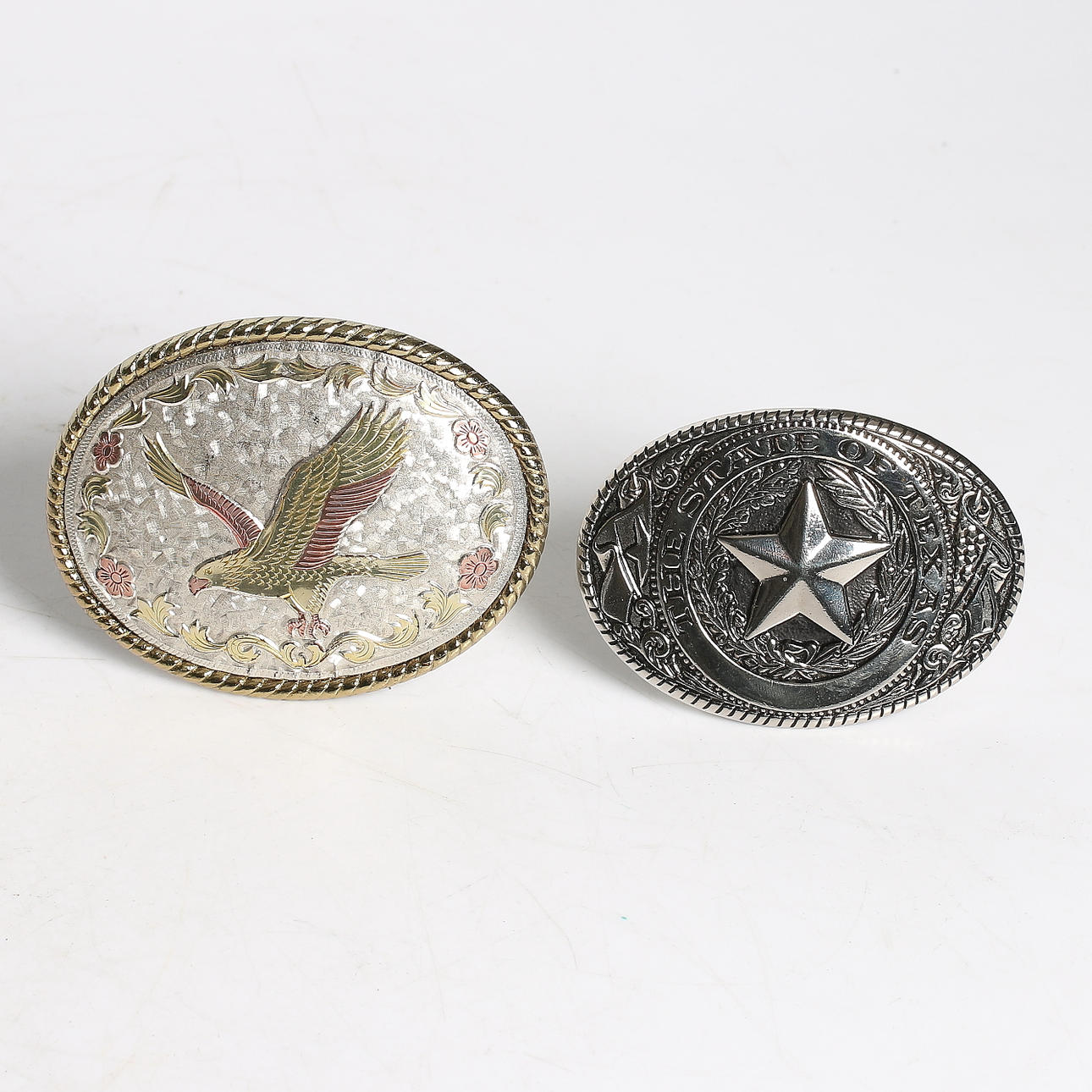 BÄLTSPÄNNE, 2 st, metall, USA. 1900-tal.