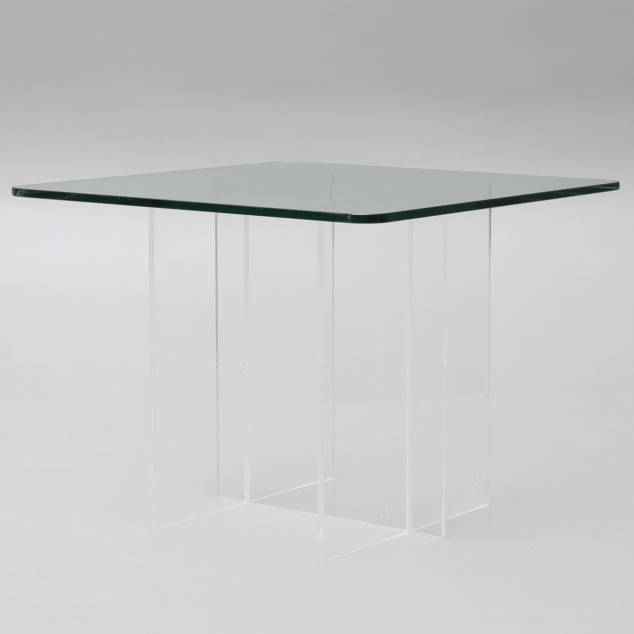 A plastic glass/glass side table, 1980s.