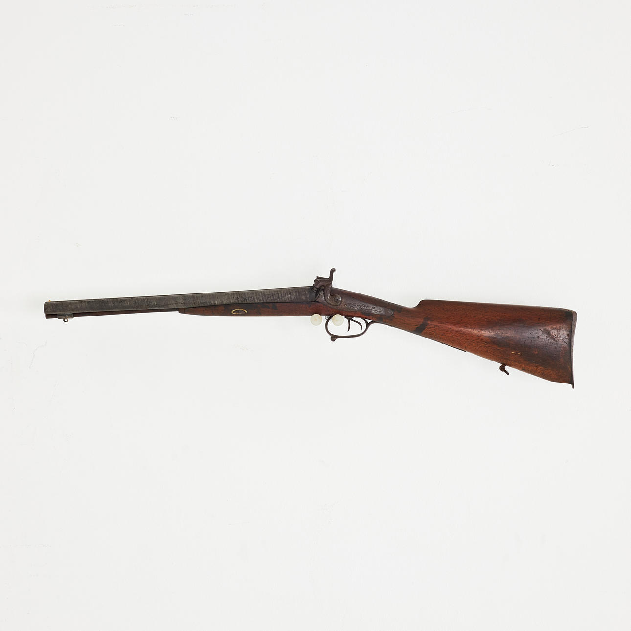 A double-barreled breech-loading rifle, unmasked barrel, blackened log ...