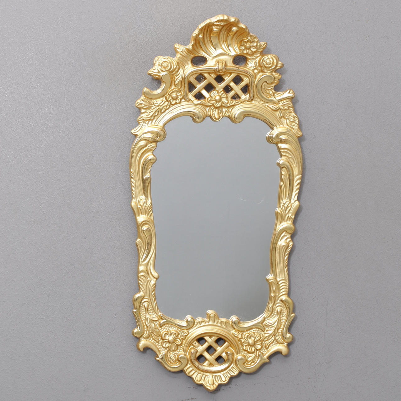A mid-20th century rococo style mirror.