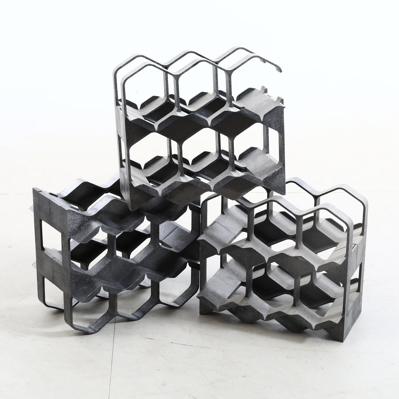 A modular, plastic 3-piece wine rack, 2000's.