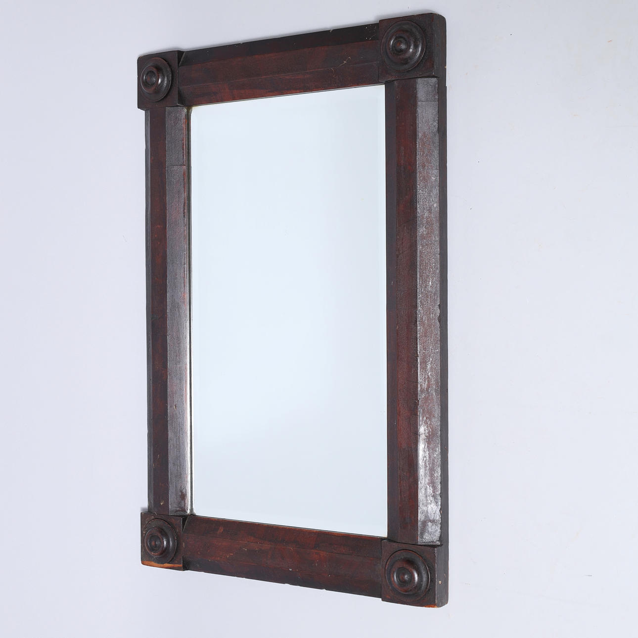 Rectangular wall mirror with beveled edge, dark stained wood frame, first half of 1900.