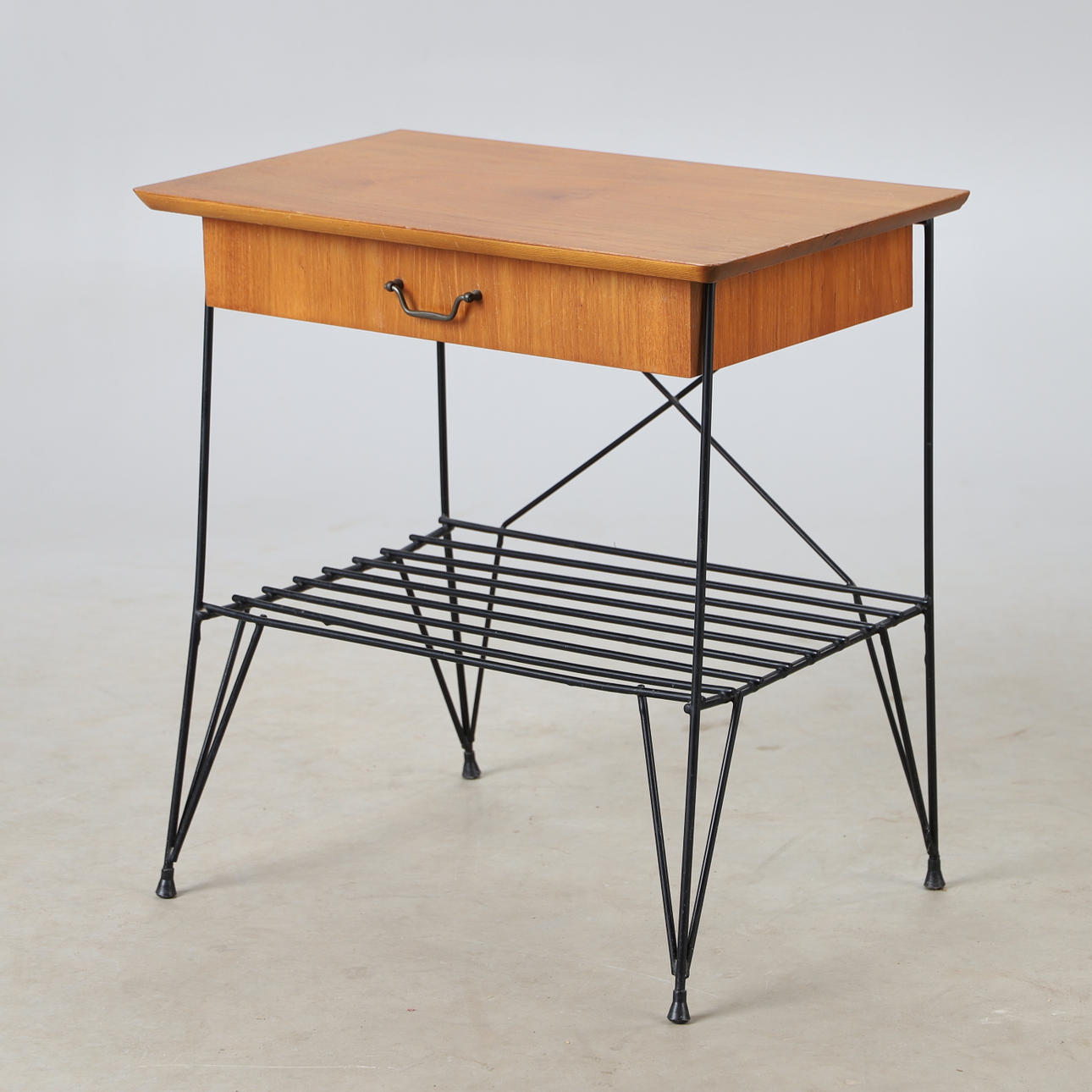 A teak and metal side table, string model, mid 20th century.