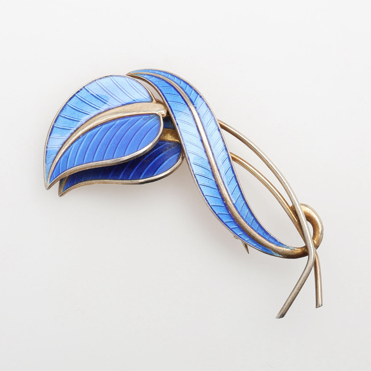 ALBERT SCHARNING, Norway, sterling silver brooch with guilloche enamel. In the form of leaf grouping.