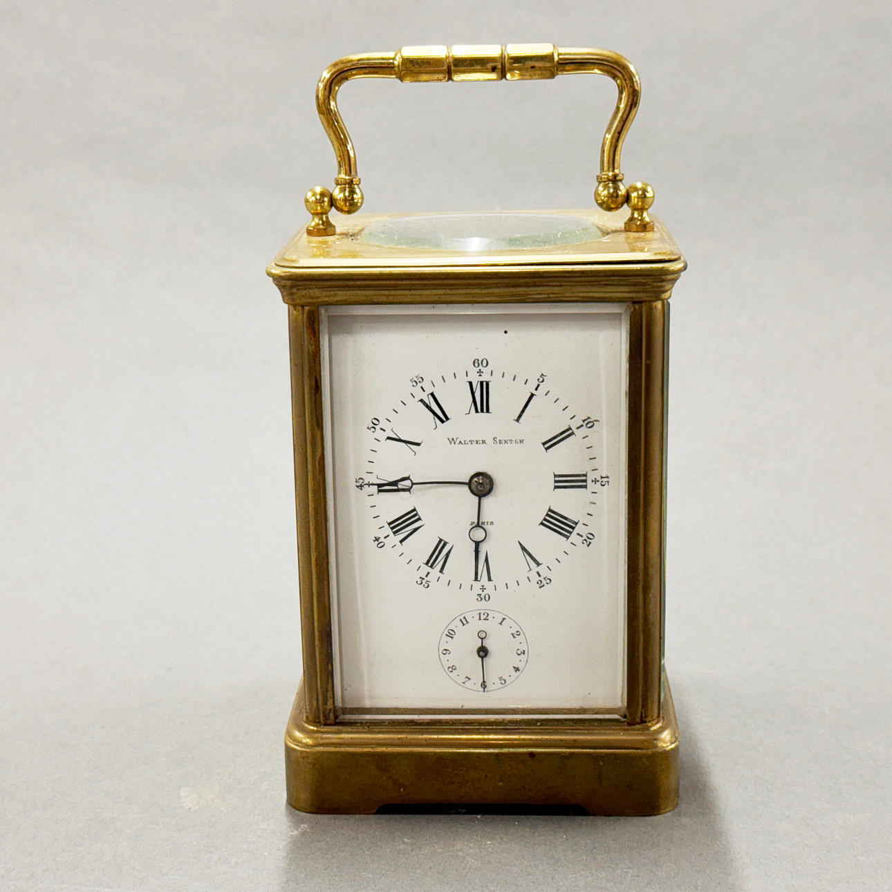 WALTER SEXTON STRIKING BRASS CARRIAGE CLOCK.