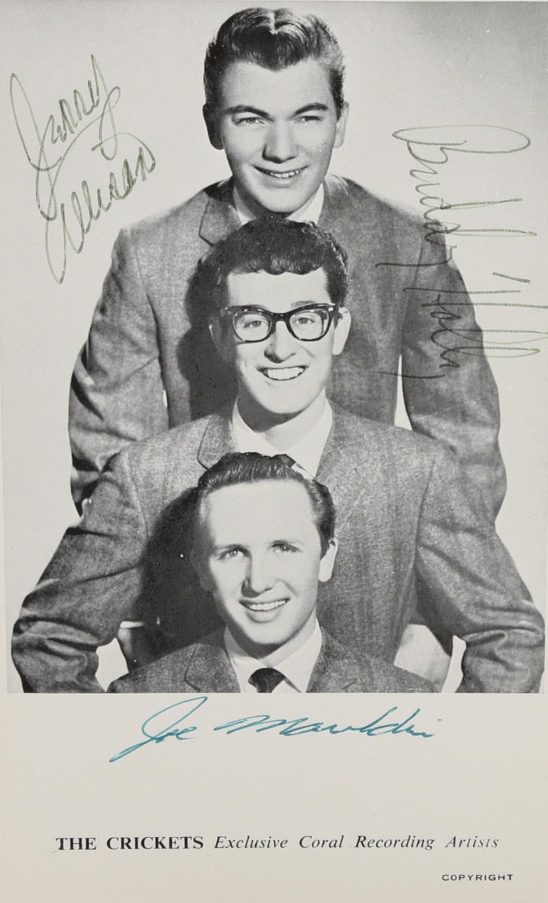 BUDDY HOLLY & THE CRICKETS. A SIGNED CORAL POSTCARD.