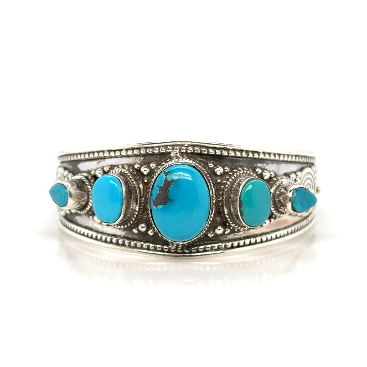 SILVER BANGLE WITH TURQUOISES.