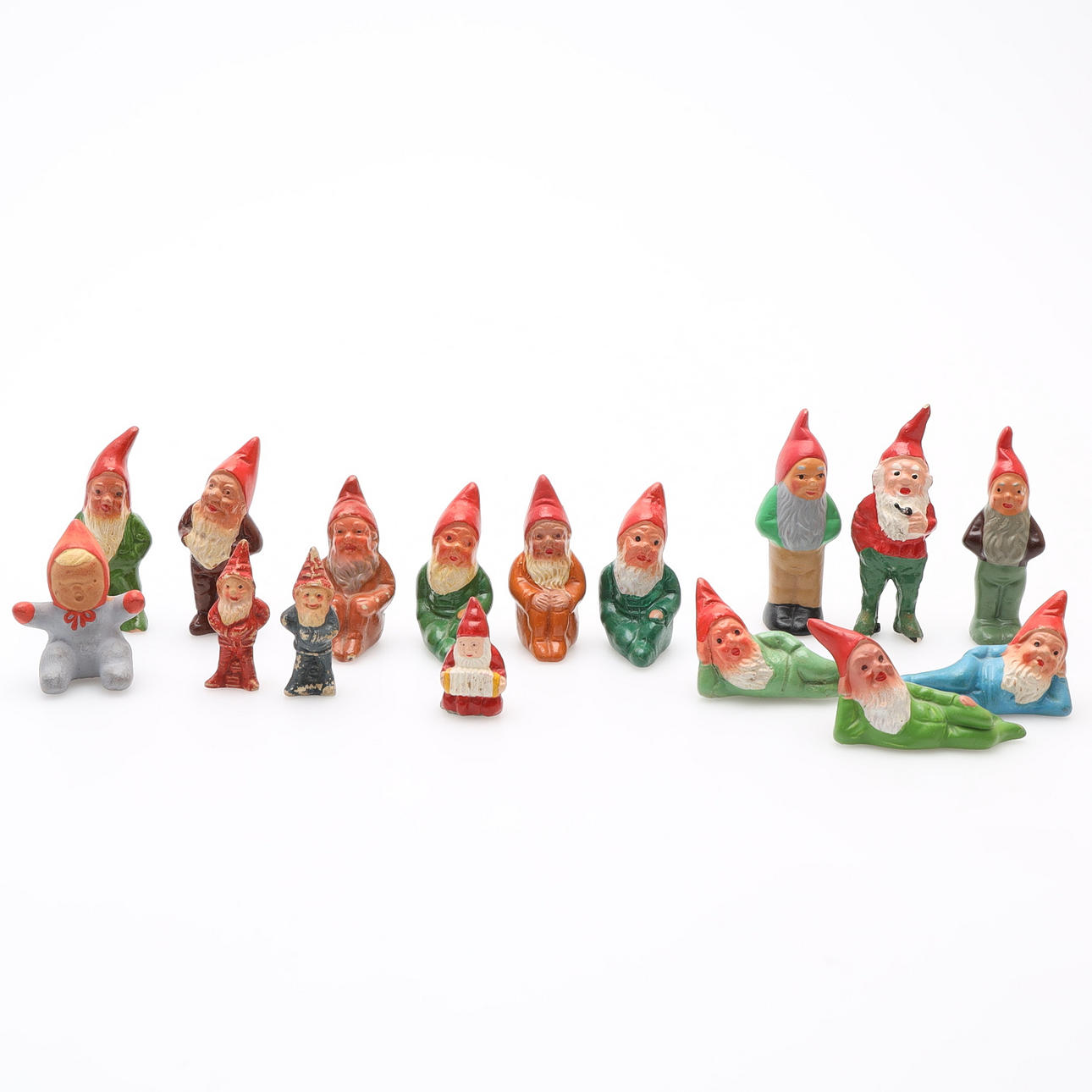 A collection of 16 ceramic gnomes.