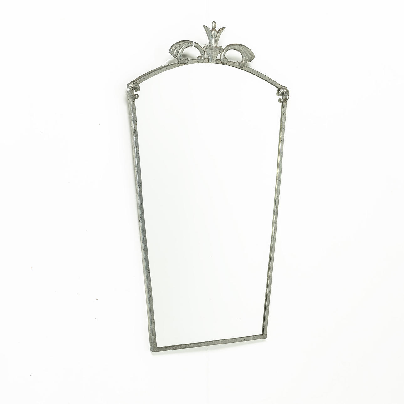 A 1930 pewter mirror.