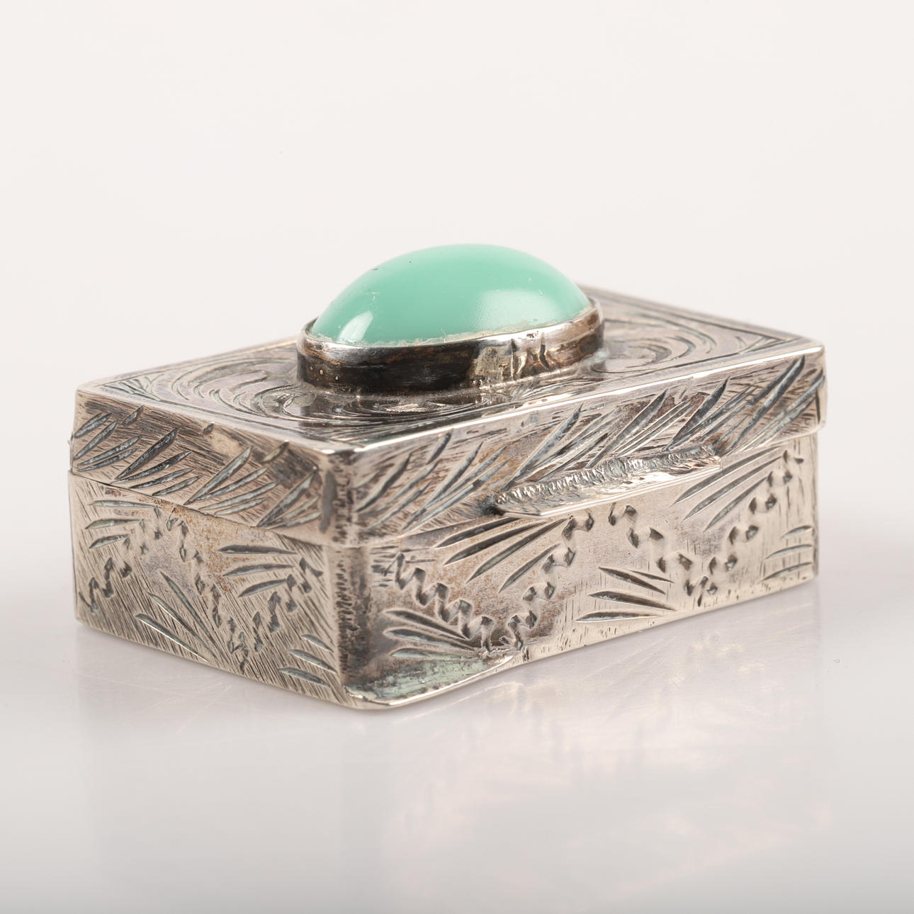 PILLERBOX, silver with decor and cabochon-cut green stone.
