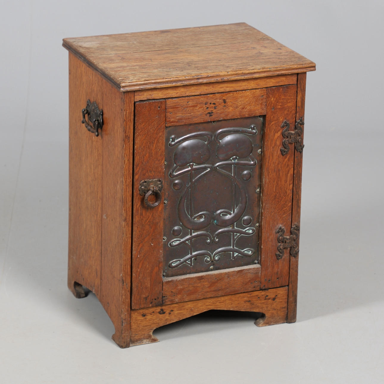 AN ARTS AND CRAFTS CUPBOARD.