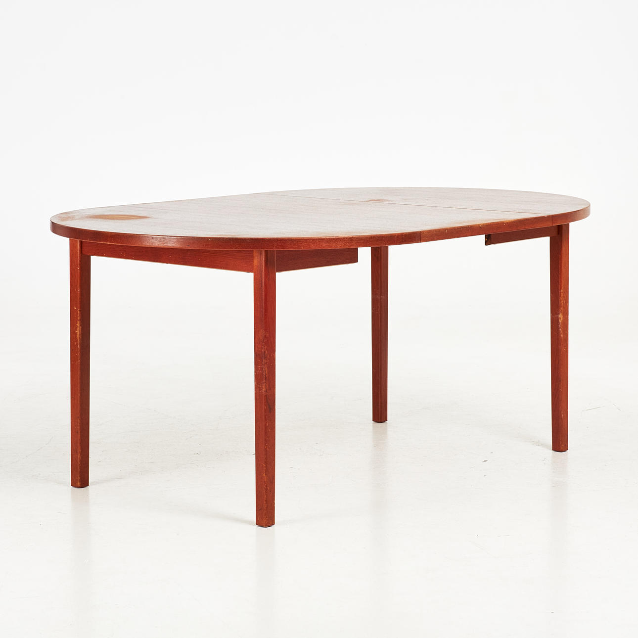 DINING TABLE. 1960s, teak, with insert top.