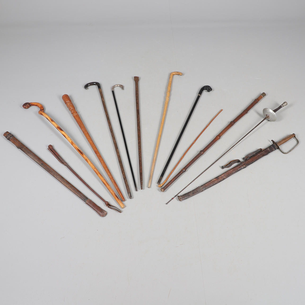 SILVER TOP WALKING CANE & VARIOUS WALKING STICKS & SWORD.