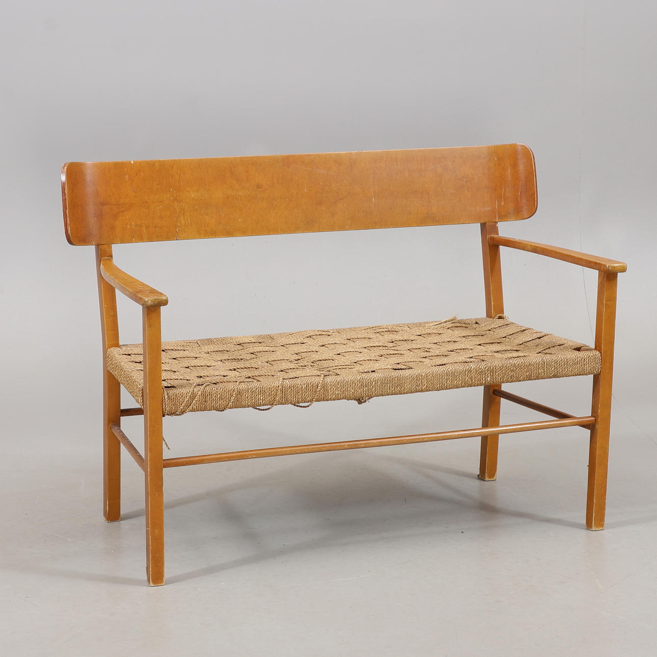 A 1950s/60s wood/jute sofa.