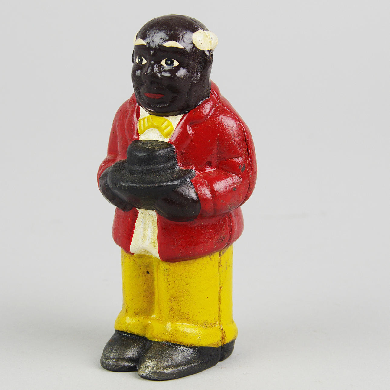 SPARBÖSSA, färgad man, målad gjutjärn, samtida.