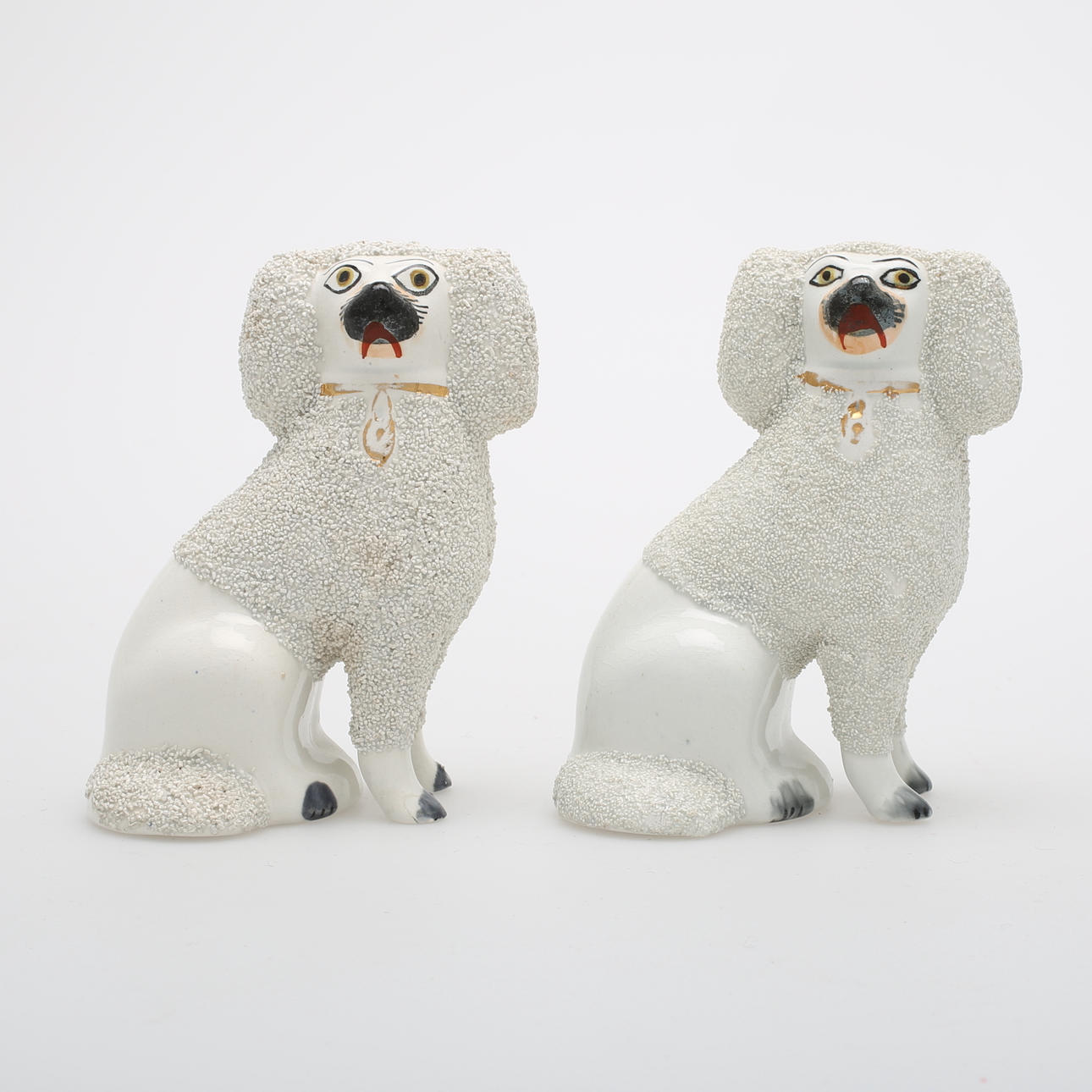 HEMVÄNDARHUNDAR, ett par, porslin, Staffordshire, 1800-tal.