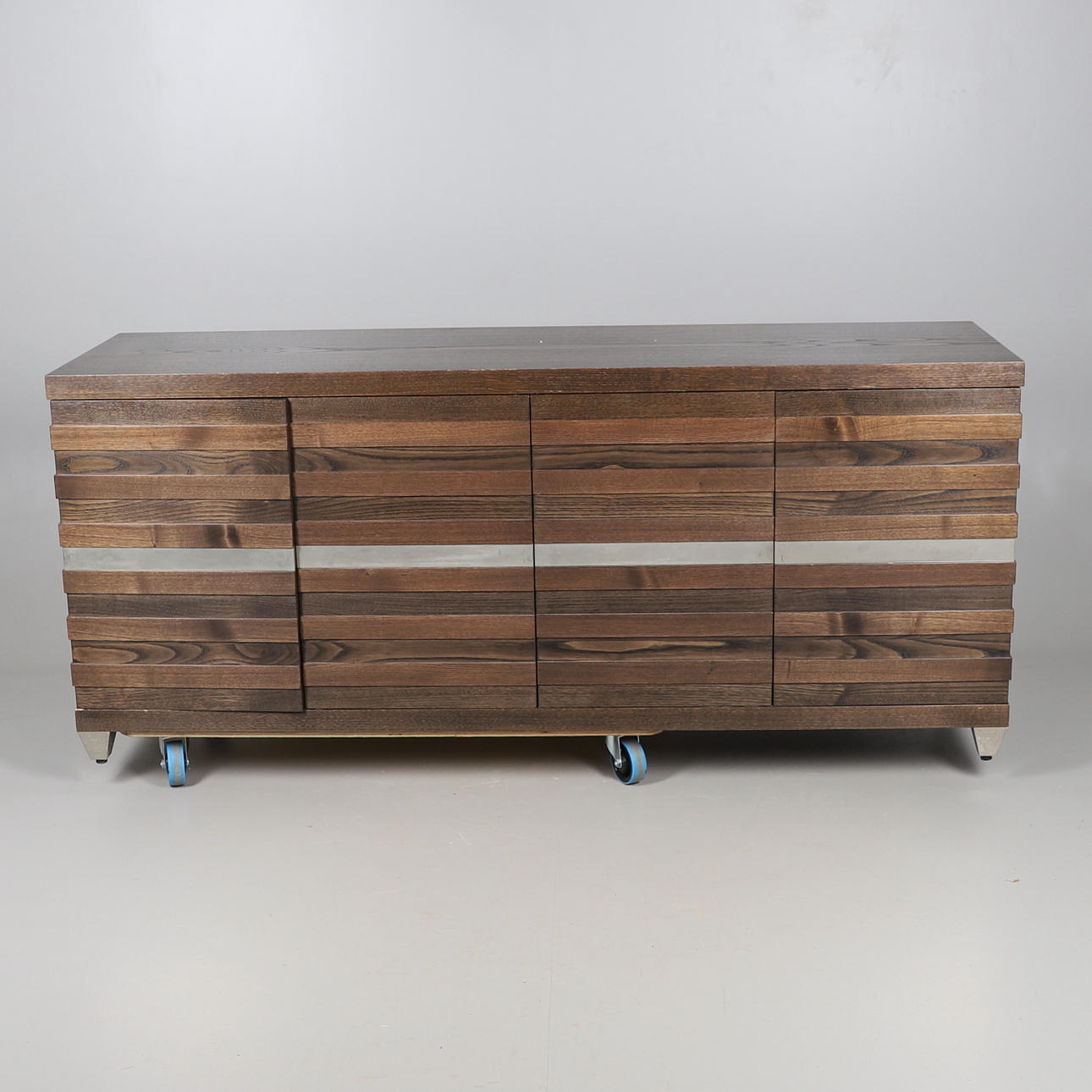 A CONTEMPORARY OAK SIDEBOARD.
