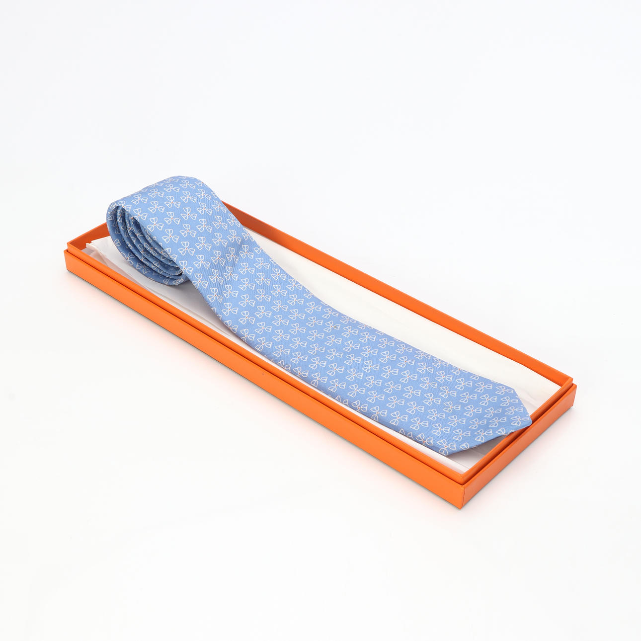 HERMÈS, TIE. Silk, light blue and patterned.