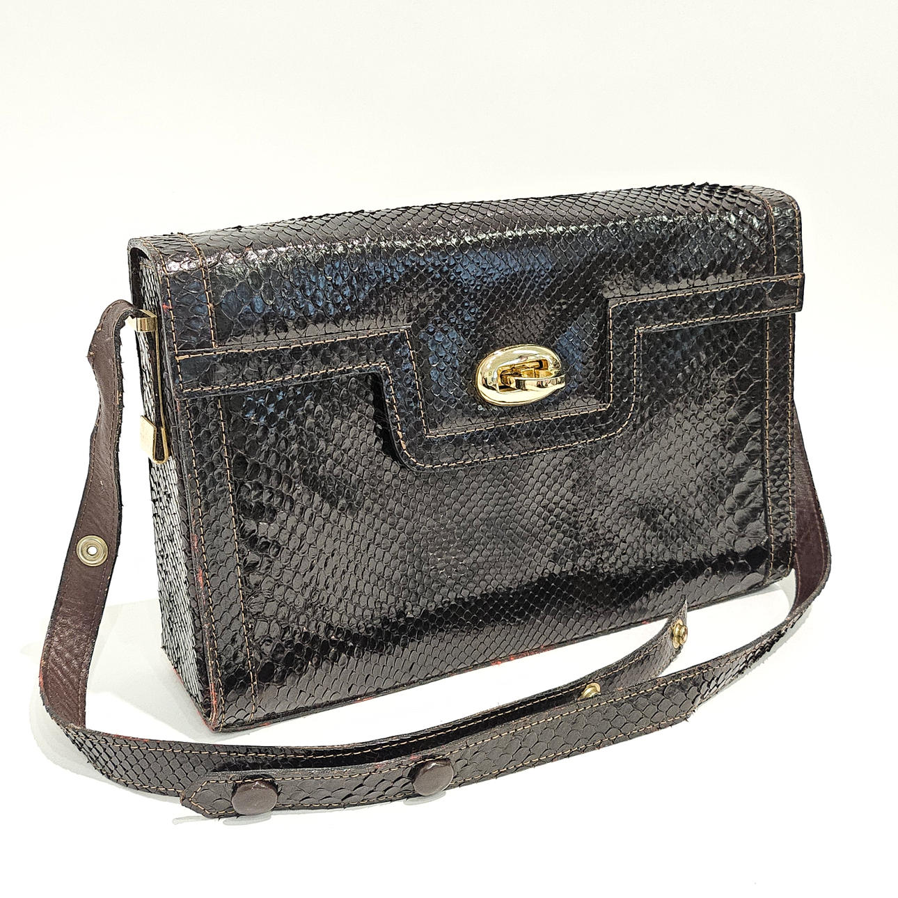DARK BROWN SNAKESKIN BAG. ADJUSTABLE SHOULDER STRAP.