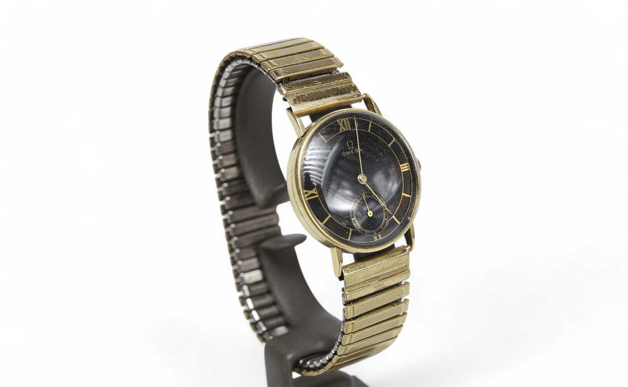 ARMBANDSUR Omega, 14k guld med flexlänk, ca år 1945.