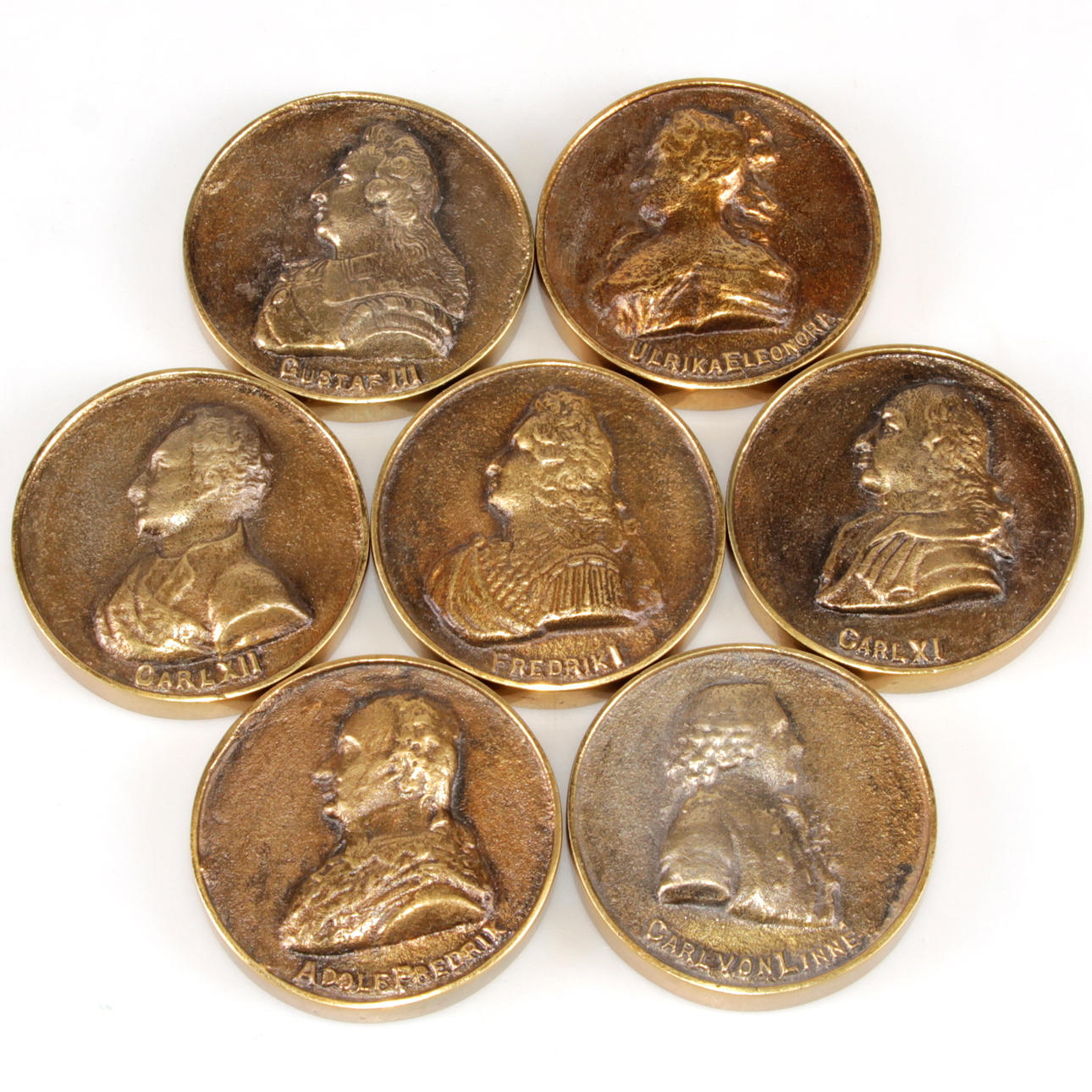 PLAKETTER, 7 st. Mässing, 1900-tal.