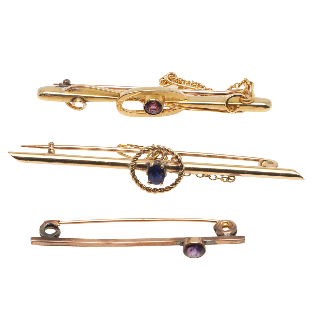 TRES BROCHES CON BARRA DORADA.