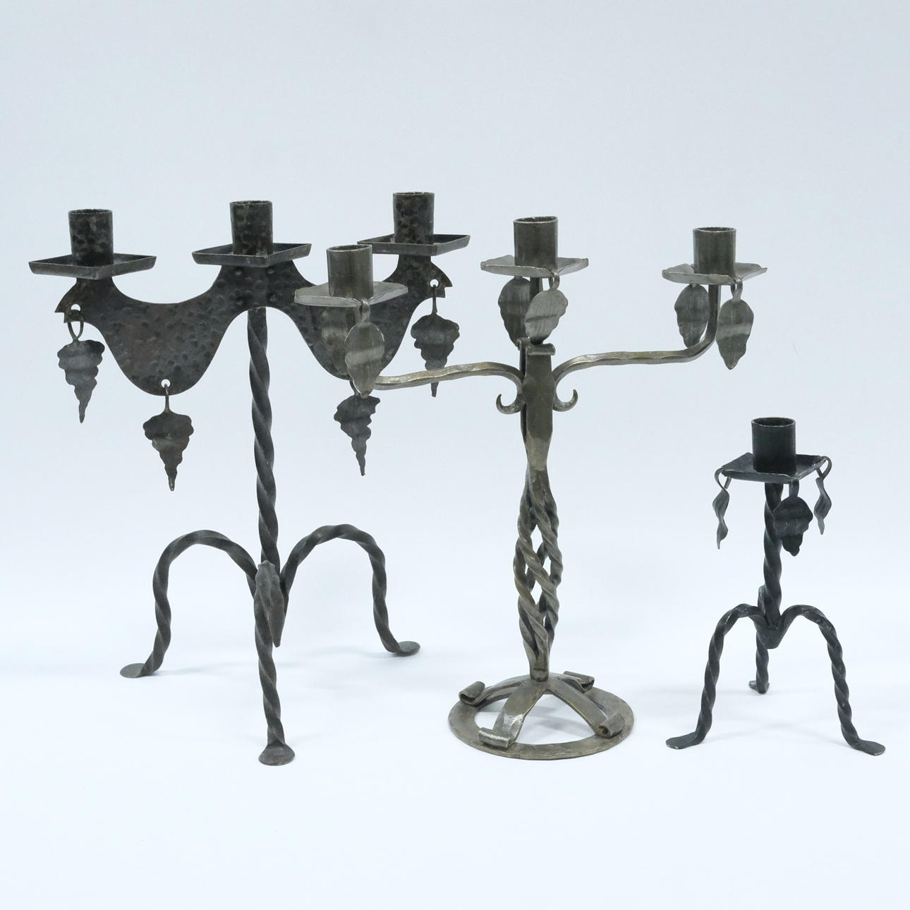 CANDLESTICKS, WROUGHT IRON, THREE PIECES.