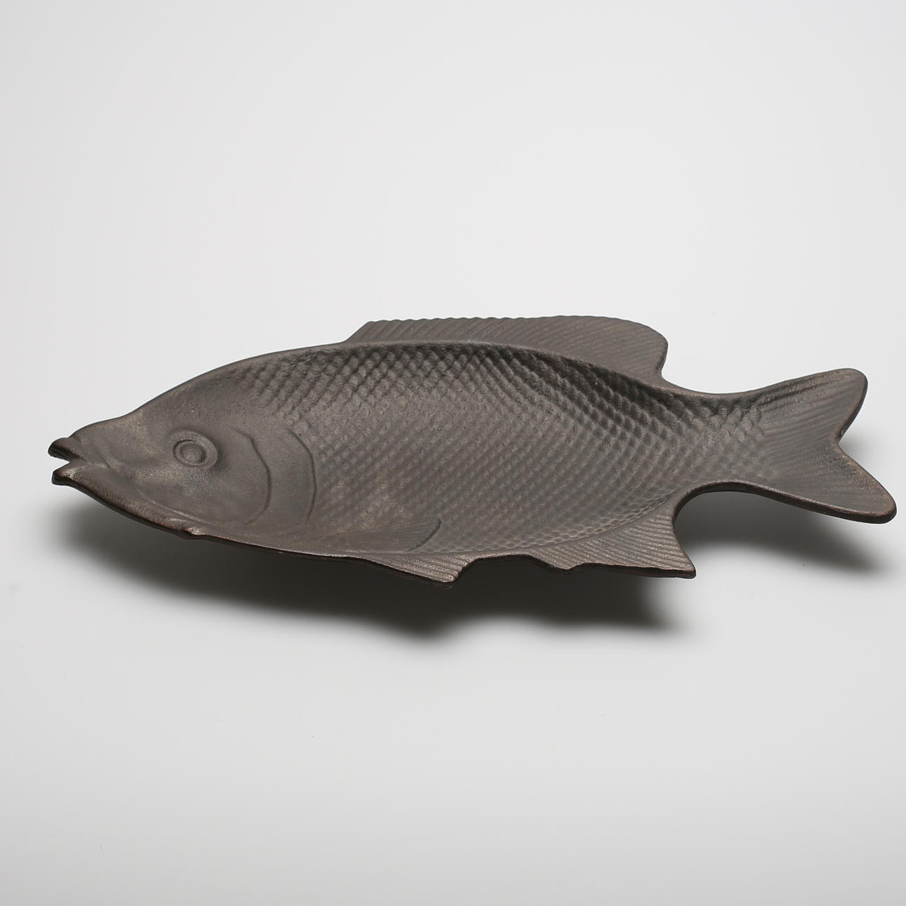 FAT, gjutjärn, föreställandes fisk.