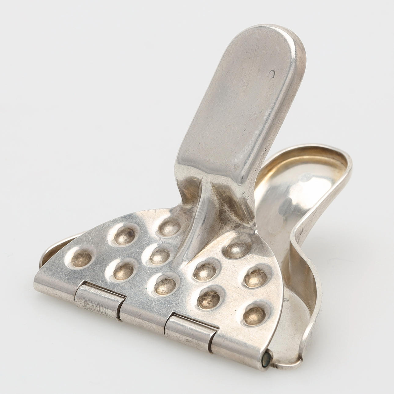 A silver lemon press, 1936.