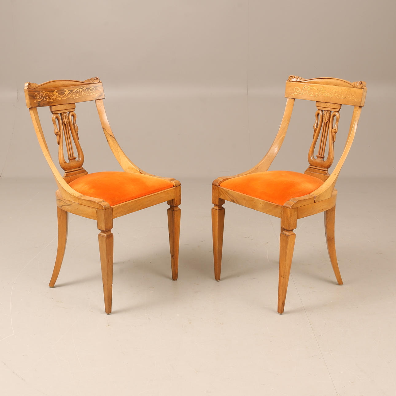 2 Empire style chairs.