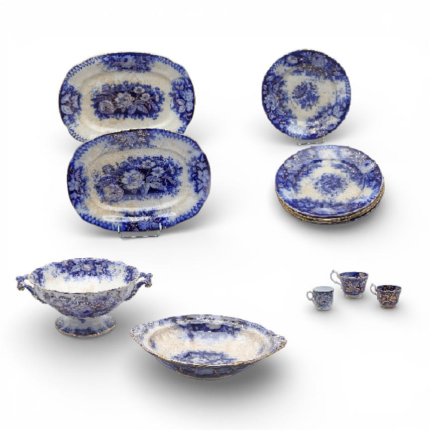 French "flow blue" earthenware tableware from the late 19th century.