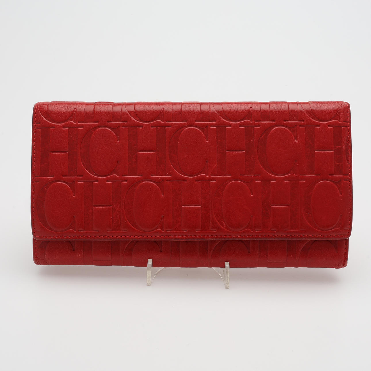 CARINA HERRERA RED MONOGRAM LEATHER OVERSIZE CONTINENTAL WALLET.