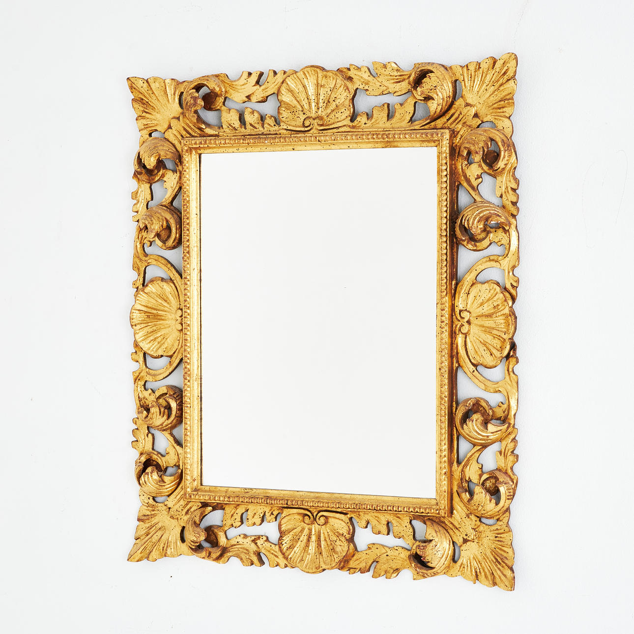 A 20th century rococo style mirror, gilt openwork frame.