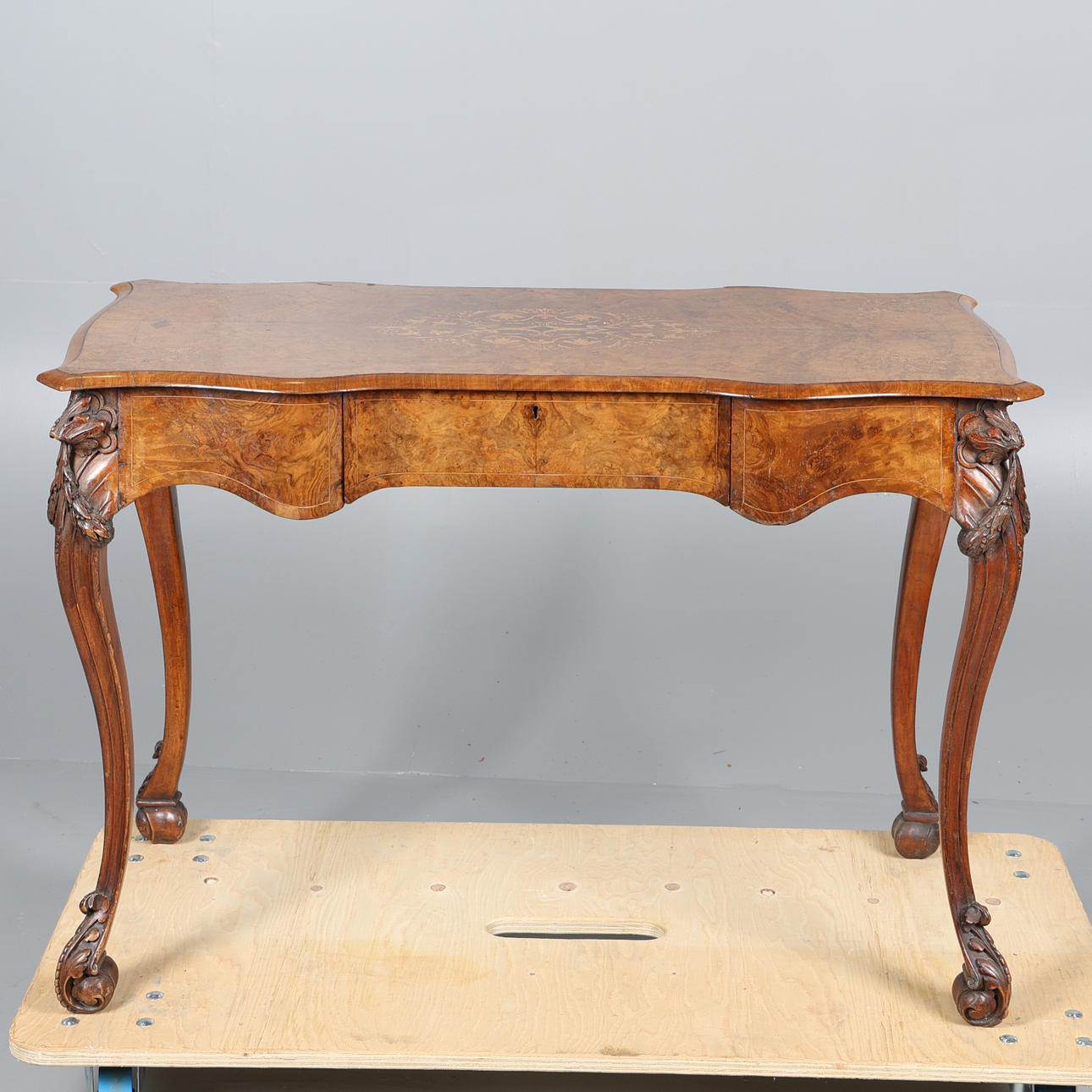 A 19TH CENTURY WALNUT SIDE TABLE BY EDWARDS AND ROBERTS.