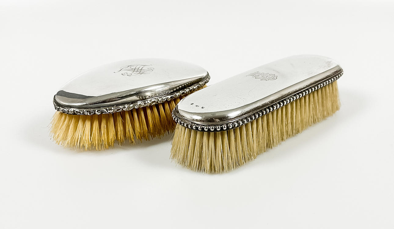 CLOTHES BRUSHES, silver, circa 1920.