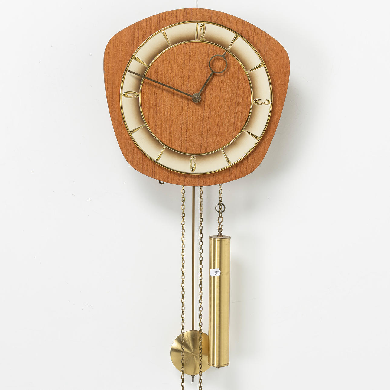A teak wall clock, 1960s/70s.