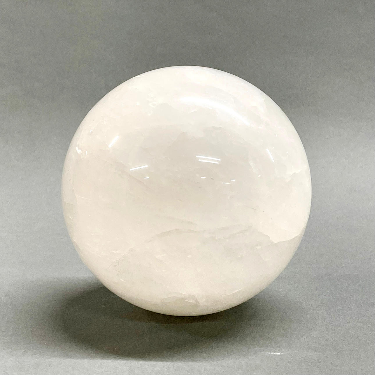 LARGE POLISHED QUARTZ CRYSTAL BALL.