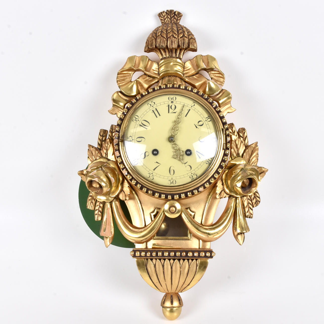 A wall clock, gold pendyle, rococo style.