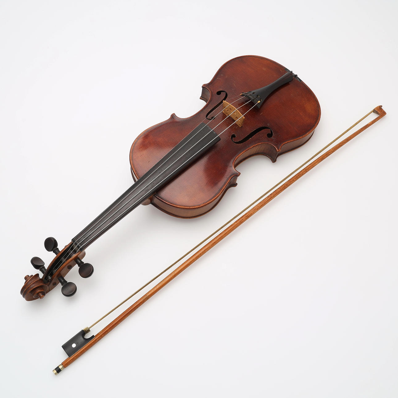 Violin, labelled C.W Meisel senior, Antonius Stradivarius, and string.