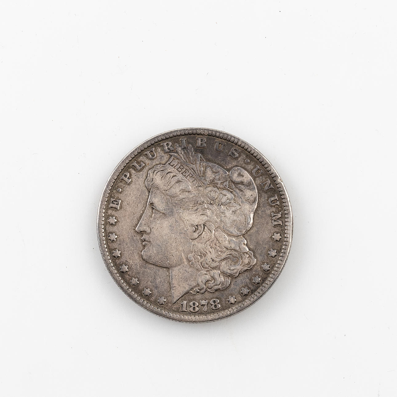 A US Morgan One Dollar coin, silver, 1878.
