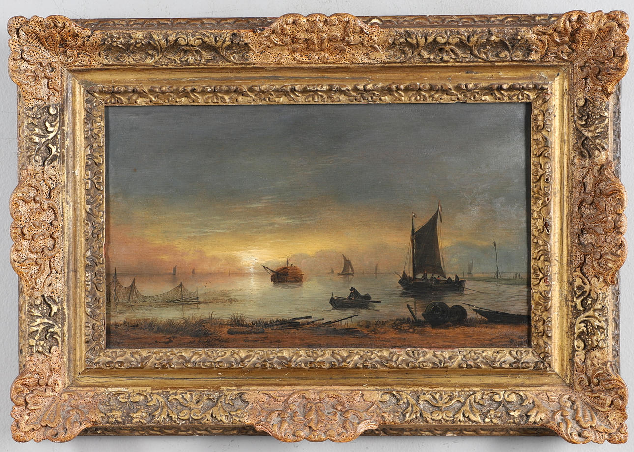 AERT VAN DER NEER (1603-1677). SHIPPING IN AN ESTUARY AT SUNSET.