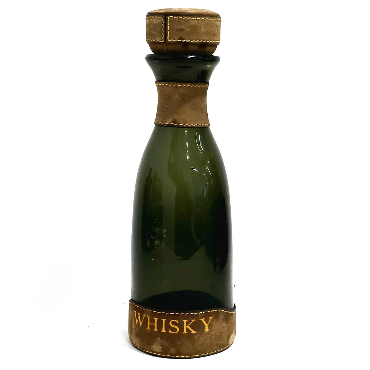 WHISKEY BOTTLE IN GLASS AND LEATHER.