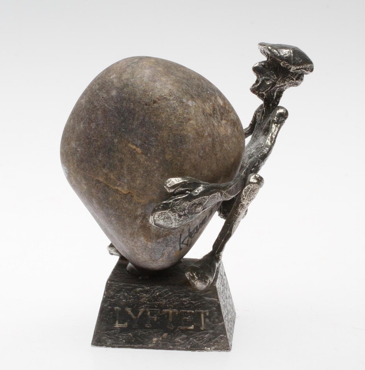 HENRY GUSTAFSSON. "Lyftet". Skulptur, tenn och sten, signerad.