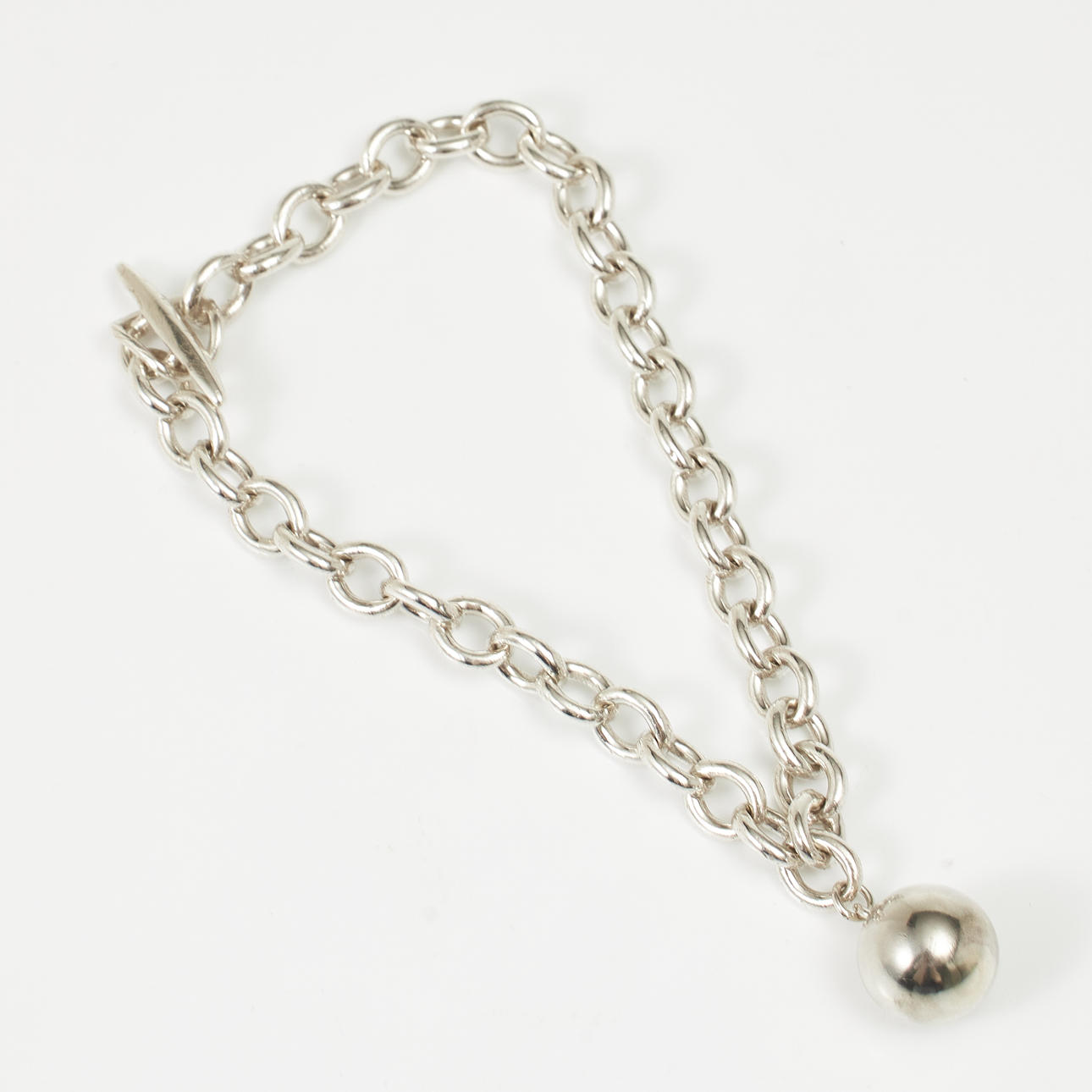 BRACELET, sterling silver, anchor link with ball shaped charm, toggle clasp, probably Denmark.